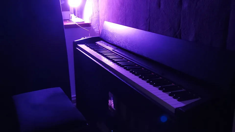 Digital piano lit in purple, used to compose the Shallow Wish soundtrack